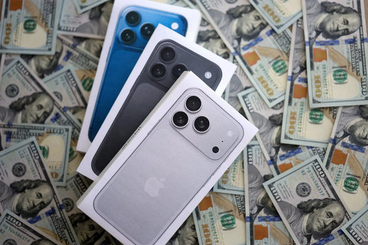 Assorted iPhone 11 and newer models displayed during evaluation at PayMore Kennesaw
